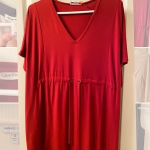 Red Calvin Klein dress with tie detail.